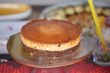  Caramel custard pudding on a plate on table 