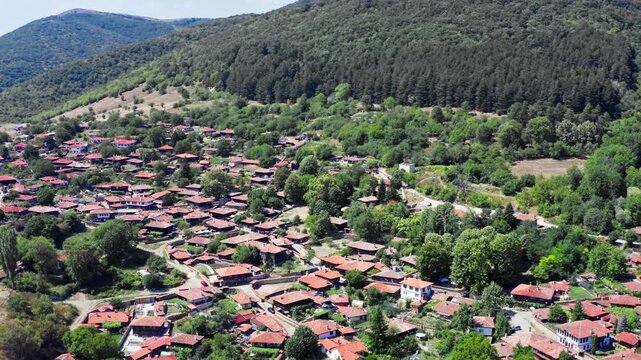 Red rooftops Bulgarian Balkan mountain village Zheravna Drone Reveal
