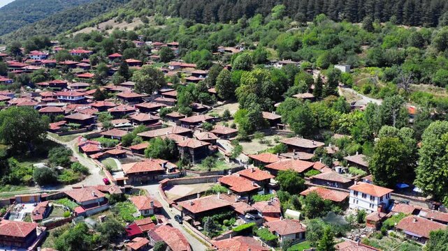 Zheravna Bulgarian Balkans mountain hillside remote village Drone shot