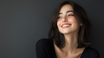 Obraz premium Happy Young Woman Portrait on Grey Background