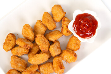 Homemade chicken nuggets with ketchup