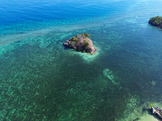 Aerial view of tiny island outside Rangko Cave in Tanjung Boleng, Boleng, West Manggarai Regency, Flores, East Nusa Tenggara, Indonesia