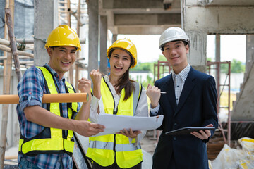 Team architects workers, men and women, join hands to join forces to join forces to work for the industry for success. Teamwork and professional colleagues : Workers' hands, teamwork concept.