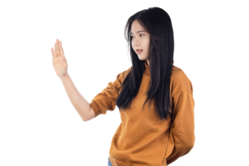 Young Asian woman raising her hands up in defensive stop gesture isolated on white background with clipping path.