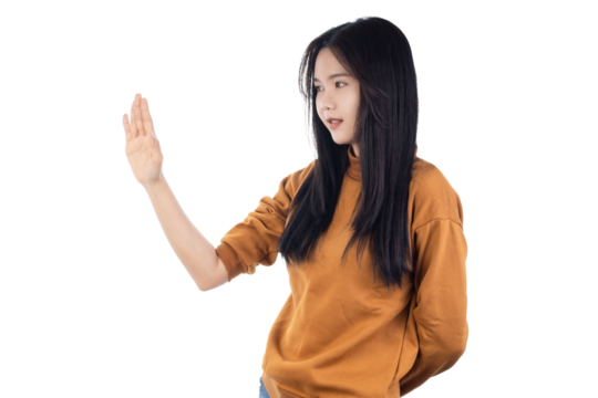 Young Asian woman raising her hands up in defensive stop gesture isolated on white background with clipping path. - Powered by Adobe