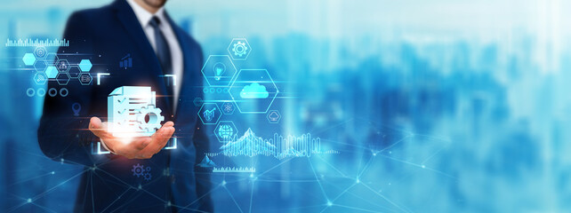 Project Management: Businessman holding task management icon. Digital technology era of the future....