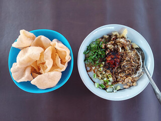 Bubur Ayam Indonesian food for breakfast. This food is very popular in Indonesia, rice porridge with lots of toppings.