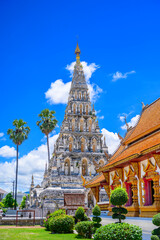 Wat Chedi Liem, also known as Wat Kum Kam, is a majestic ancient temple in Chiang Mai, Thailand. The white stupa with golden accents stands tall against a bright blue sky