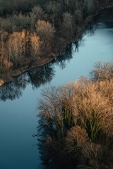 Aerial landscape picture of river bends in the countryside of Lecco province, near the Adda River