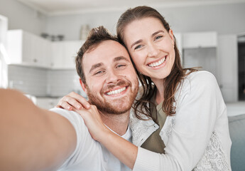 Fototapeta premium Couple, portrait and selfie in house for bonding, relax and happiness with joy, embrace and fun. Man, woman and smile in living room for love, memory and social media together in lounge with hug