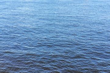 The texture of ripples on the water. Natural background.