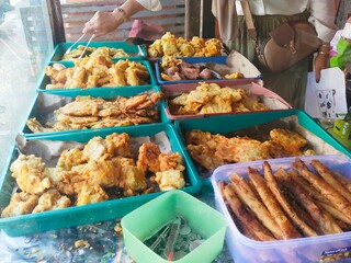 Fried snack cart, called Gorengan in Indonesia. They sell fried risoles, sweet potatoes, tempeh, tofu, fried bananas, mixed vegetables called bakwan and so on