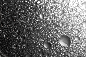 Water drops on white background texture. backdrop glass covered with drops of water. bubbles in water