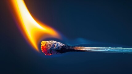 A close-up of a matchstick head burning with a vibrant orange and blue flame against a dark background. its flame gradually expanding against a transparent