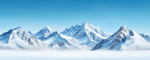 Fototapeta premium Snow-covered mountains beneath a clear blue sky, creating a peaceful winter scene