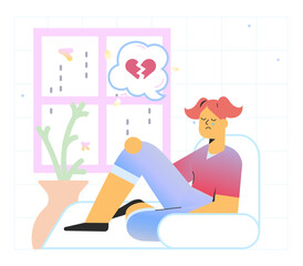 Sad girl sitting near window