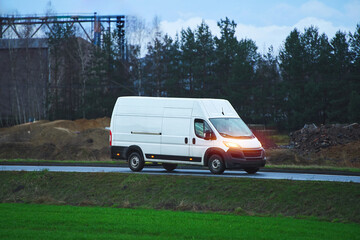 Cargo van delivering packages on countryside route