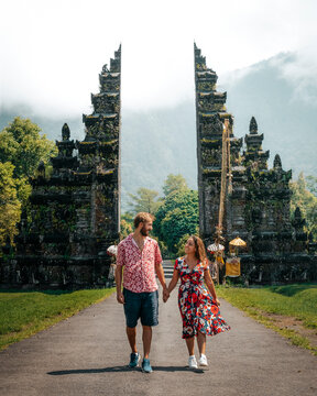 Romantic Stroll at Bali's Iconic Handara Gate: A Couple's Journey Through Culture and Nature