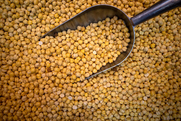 A pile of chickpeas and a scooping spoon at a food shop in Makkah city, Saudi Arabia