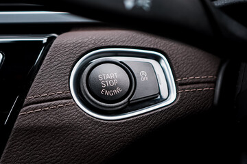 Close up engine car start button. Start stop engine modern new car button,Makes it easy to turn...