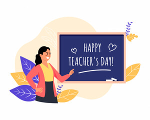 women teacher is pointing at the chalkboard that says happy teachers day