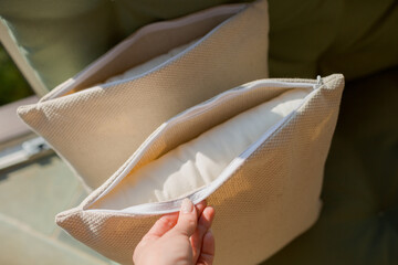 beige pillow with open zipper © Anastasiya Krychun