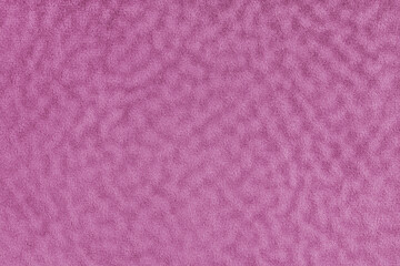 Faux fur texture with wavy effect, fluffy velours pink fabric or cloth, upholstery textile