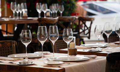 wine glasses on table in fancy restaurant by the sea