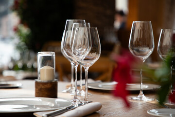 wine glasses on table in fancy restaurant by the sea