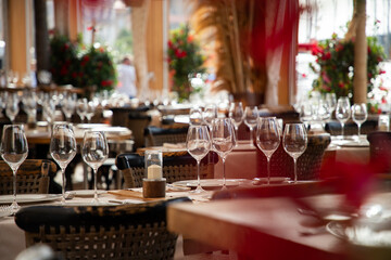 wine glasses on table in fancy restaurant by the sea