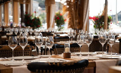 wine glasses on table in fancy restaurant by the sea