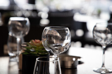 wine glasses on table in fancy restaurant by the sea