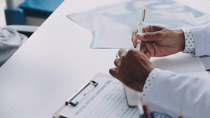 Consultation, man and doctor in office with discussion, help and advice for health insurance. Clinic, senior patient and medical professional at desk with support, trust and healthcare at checkup