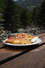 omelette on plate in the mountains