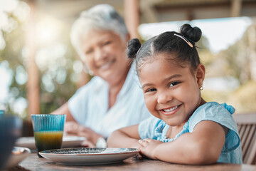 Obraz premium Portrait, lunch and grandmother with girl, smile and happiness with nutrition, relax and social gathering. Face, family and granny with kid, calm and comfort with joy, cheerful and childhood