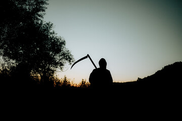 grim reaper, the death itself, scary horror shot of Grim Reaper holding scythe