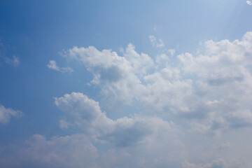 
Blue sky and white puffy clouds