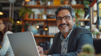 Obraz premium Young smiling professional latin business man working in corporate office with older executive manager using laptop technology having conversation on financial project strategy at work : Generative AI