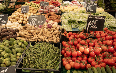 Tomatoes; ginger, beans and other vegetables at the market in Rotterdam. Healthy food, market stall, raw food.
