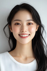 Fototapeta premium Asian woman positive smile on white background, beauty positive smile