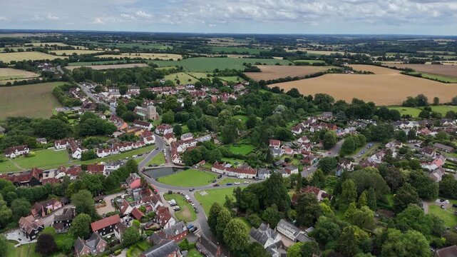 Pull back drone aerial reverse reveal Finchingfield Village in Essex UK