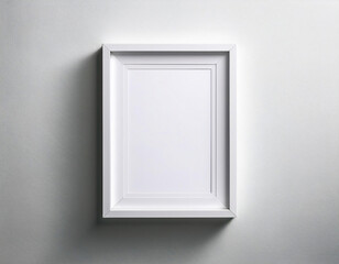 Blank white picture frame hanging on a white wall. Space for your design
