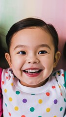 Portrait of a joyful preschool child with a bright smile, captured in a colorful kindergarten...