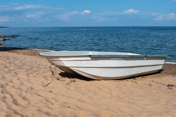 A working fishing boat on the beach in Estonia on the Peipus coast