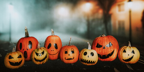 scary funny Halloween pumpkins on wooden table