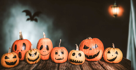 scary funny Halloween pumpkins on wooden table