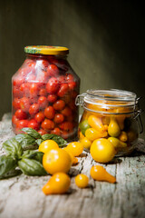red and yellow cherry tomatoes in a jar for winter