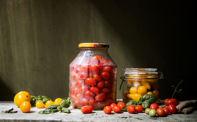 red and yellow cherry tomatoes in a jar for winter