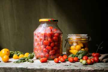 red and yellow cherry tomatoes in a jar for winter