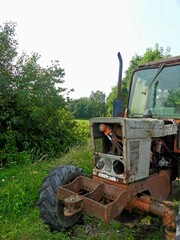 Hiking in the Argonne forest in France - View of a ruined tractor